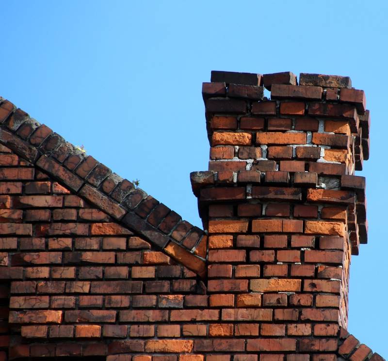 Signs Your Sachse Home Needs a Chimney Inspection Damaged chimney on an Sachse home showing cracks and missing mortar